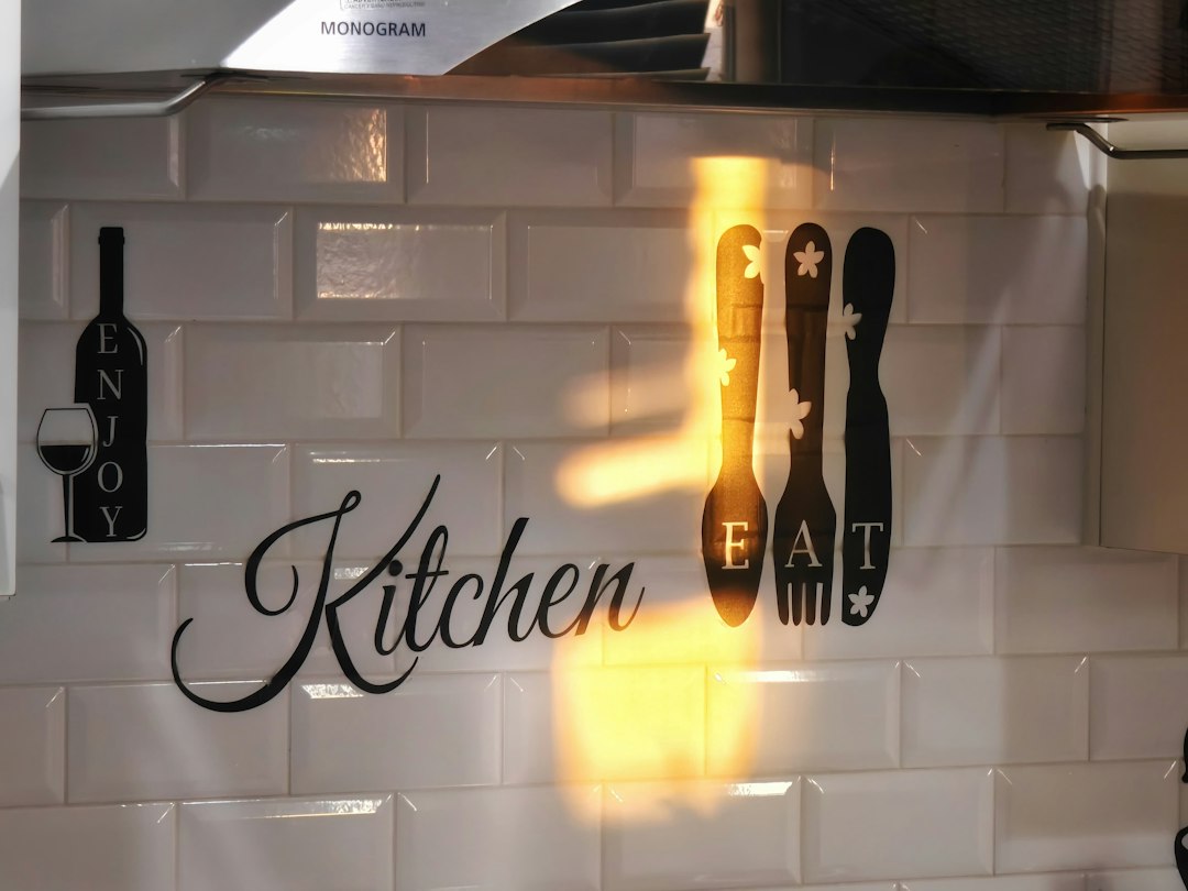 white subway tile with dark charcoal grout lines on a kitchen wall