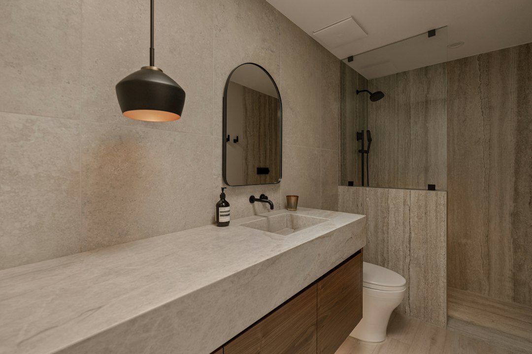 vertical stacked white subway tile shower wall