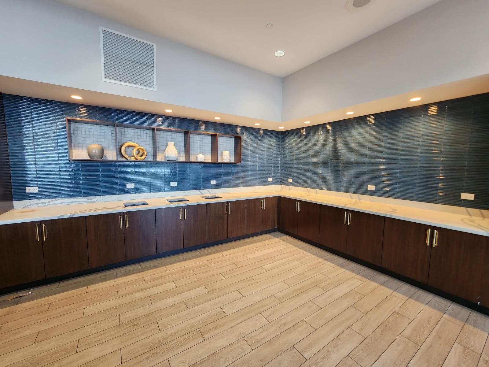 blue linear tile backsplash installed by Aguirre Modern Tile