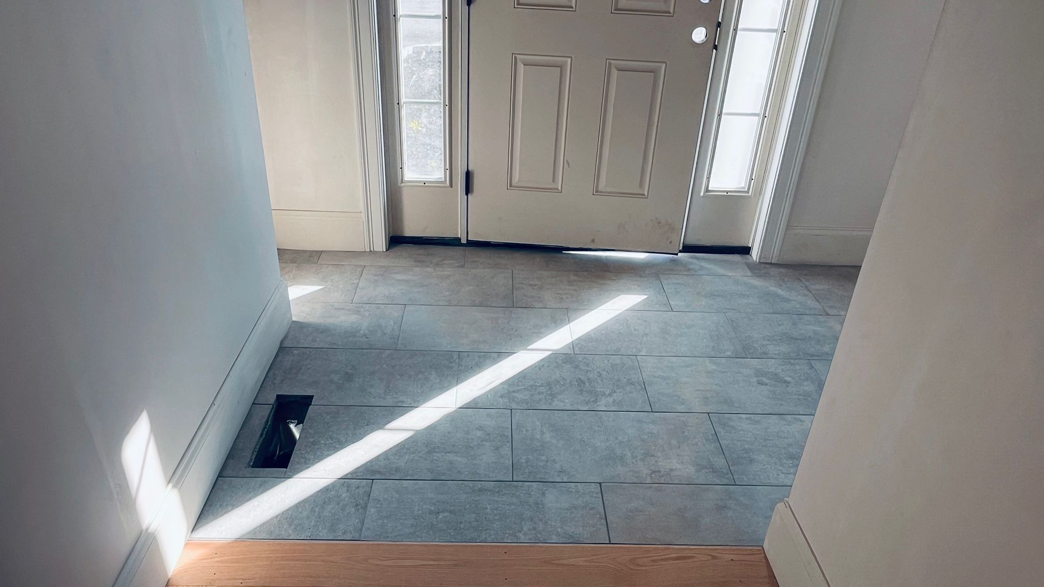 porcelain tile entryway floor installed by Aguirre Modern Tile