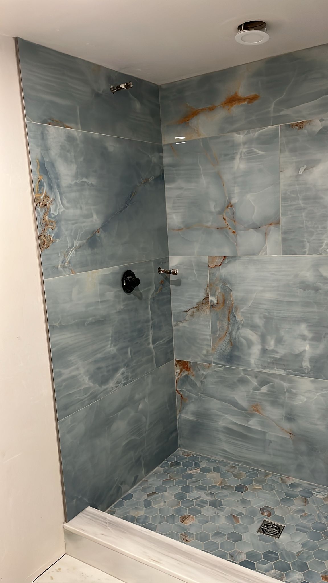blue onyx stone tile shower walls
