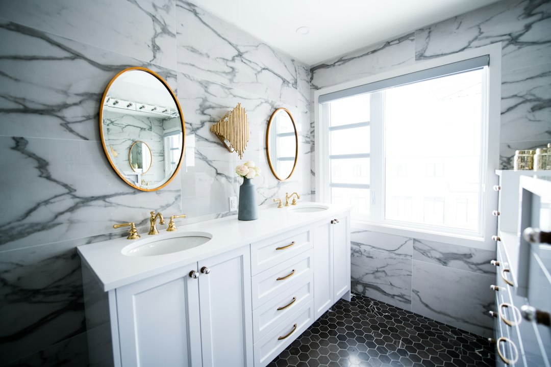 white hexagon floor tile with black grout in a bathroom